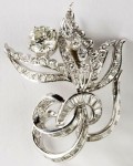 Diamond brooch This stunning circa 1955 14kt white gold diamond brooch in a floral spray design realized $3,910.