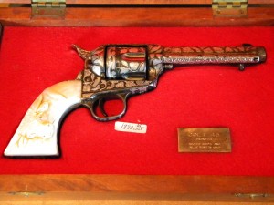 Colt pistol A Colt .45 frontier pistol (circa 1875-1890), all engraved and with two handles (one sterling silver).