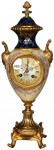 Tiffany clock A Tiffany & Co. pedestal urn-shaped clock with yellow satin porcelain body, gilt metal highlights.