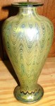 Tiffany vase This stunning Tiffany art glass vase in iridescent green with upward threaded design will be sold at auction on Feb. 20, 2010.