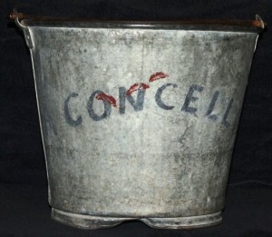 Concello Bucket Two buckets of water were delivered to each performer in the dressing tent. This bucket was used by Art Concello when he was head of the Flying Concellos. Performer buckets have sold in the past for $25-$50, but because Art Concello was so well known, both as a performer and circus executive, this one would probably bring $100 or more.