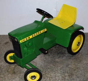 John Deere Many John Deere collectible toys, like this pedal tractor in excellent condition, will be sold at a monstrous two-day auction on Feb. 20-21, 2010.