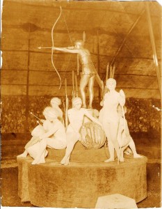 Living Statues The Living Statues was a popular act during the 1920s and 1930s. Charlotte Shive is the Golden Indian in this tableau. This photo was taken by Harry A. Atwell and is valued at $75 to $100.