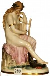 Meissen figurine This 7-inch marked Meissen crossed sword figurine of a siren with harp and serpent went for $2,000.