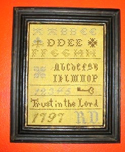 sampler This decorative sampler is brand new, even though it looks old and has a date of “1797.”