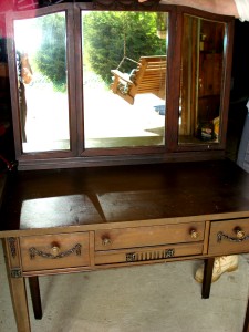 Adam The swags and drops on this vanity of the late 1920s identify it a reproduction of the Adam style of the late 18th century.