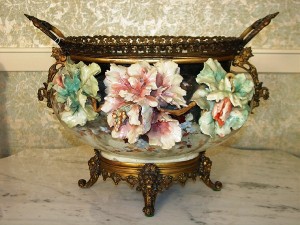 Center bowl A Victorian Italian center bowl with hand-painted and embossed flowers with bronze mounts is among the items to be sold at an absolute auction on Saturday, March 27, 2010 in Abereen, Miss.