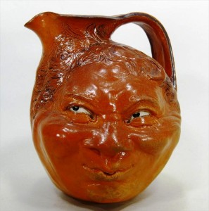 Martin Brothers jug This Martin Brothers glazed stoneware double-face jug, English, dated May 1899, brought $9,300.