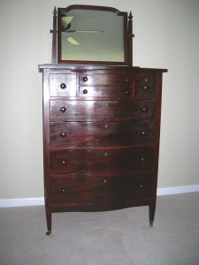 Shellac This chest of drawers with mirror is from the mid 1910s. It has the original hand-applied shellac finish that has now oxidized and obscures the mahogany beneath. It is original but is it pretty?