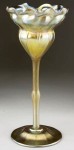Tiffany vase This Tiffany floriform Favrile vase, 11 inches, gold with light green iridescence, signed L.C. Tiffany, are among the 800 lots up for auction March 20,2010.