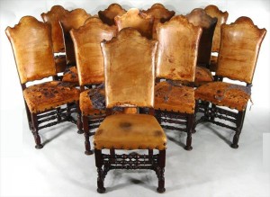 Walnut highback chairs This set of 12 early-20th-century walnut high-back leather chairs in the 17th-century style were won for $20,400.