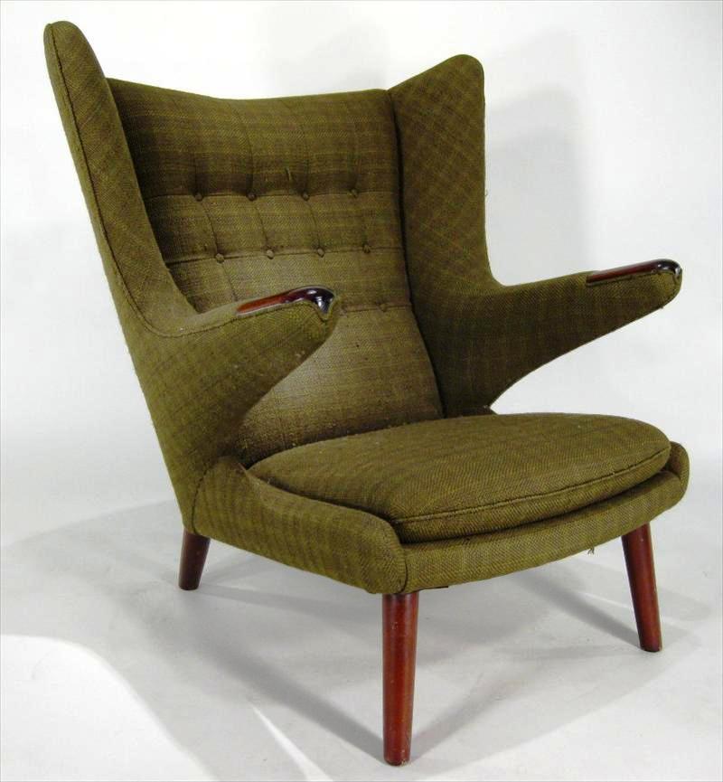 Hans Wegner chair An example of Modernist Hans Wegner’s “Papa Bear” armchair in dark green upholstery will be among the items offered in an online auction facilitated by Litchfield County Auction that will close on April 28, 2010.