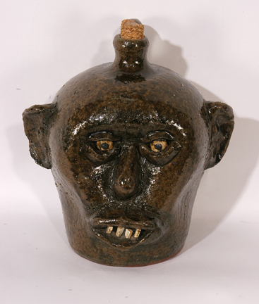 Lanier Meaders A China plate teeth face jug (circa late 1960s), attributed to Lanier Meaders, should bring between $3,000 and $5,000.