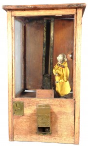Wood gum vendor Very early “Yellow Kid” wood gum vendor, in good original condition, with key ($6,000).