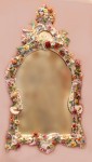 Meissen mirror This 19th-century Meissen porcelain mirror with applied flowers and cherub brought $6,720.