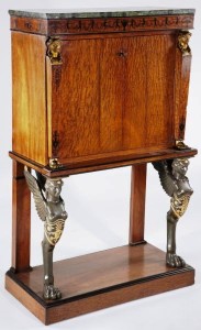 French Abattant This diminutive French Empire abattant, mahogany with marble top over inlaid frieze, sold for $9,200.