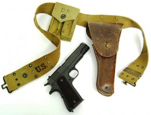 Colt model 1911 pistol Colt model 1911 A1 .45 automatic pistol, 1943, with WWII holster and belt (est. $1,000-$2,000).