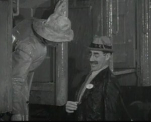 Groucho badge As Groucho Marx tries to board the circus train he shows his brother Chico his badge.