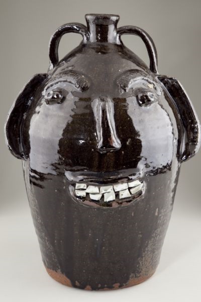 Face jugs are a uniquely Southern art form. This 5-gallon face jug made by Face jugs are a uniquely Southern art form. This 5-gallon face jug made by