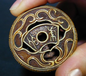 Signature on a manju netsuke made from ivory