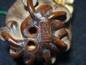Wooden netsuke signed on bottom