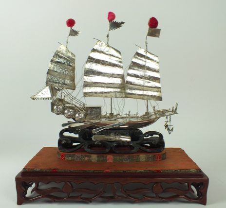 miniature silver ship