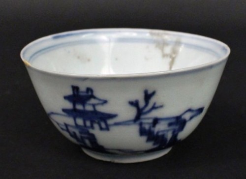 Chinese blue and white kangxi porcelain finger bowl with blue banding on interior, exterior with landscape with buildings and rocks, was purportedly recovered from the Vung Tau, a ship that sank off the coast of Vietnam in the late 17th century. Despite its history, it has a modest auction estimate, as it is expected to fetch between $100 and $200.