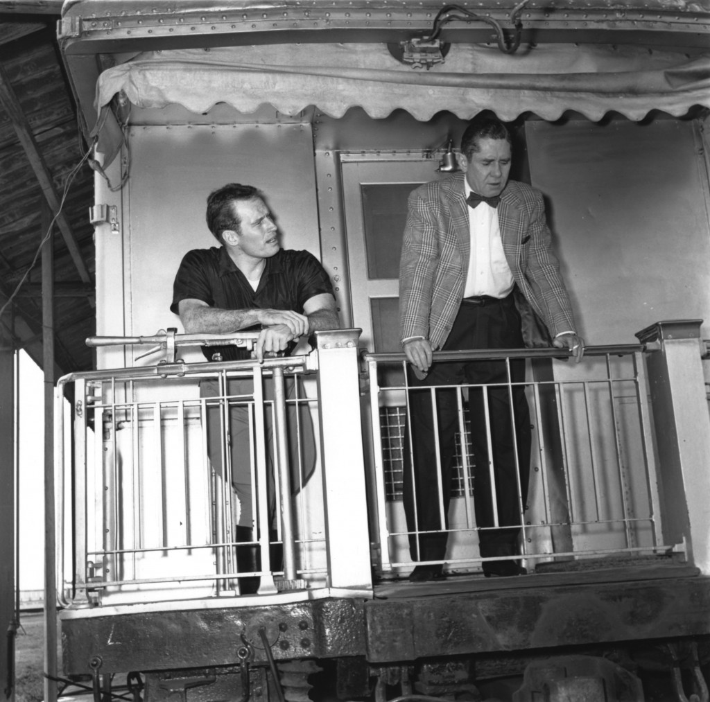 John Ringling North (left) and Charlton Heston stand on the vestibule of Jomar. Heston starred as Brad, the tough circus manager in “The Greatest Show on Earth” motion picture. (Photo: RMA-Tibbals)