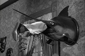 Boy, that must have some great fishing tale attached to this marlin with a leg in its mouth.
