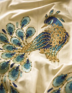 A peacock jumpsuit worn in concert by Elvis Presley realized $245,000.