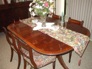 If left in place long enough, this table runner and center piece will protect the color of the table while the exposed sections fade around it. The table should be covered in the long term uniformly.